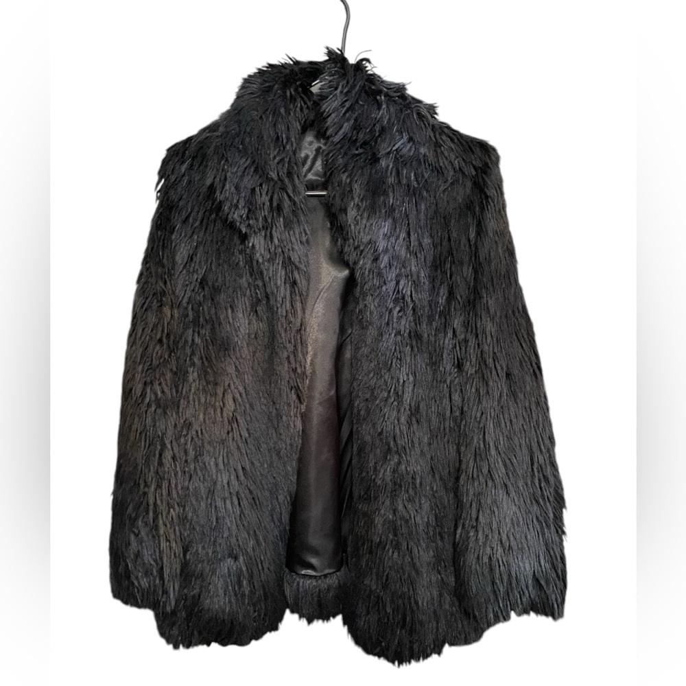 Faux Fur Coat 
Lined interior, pockets, clasp in front. Warm, weighted, luxe.